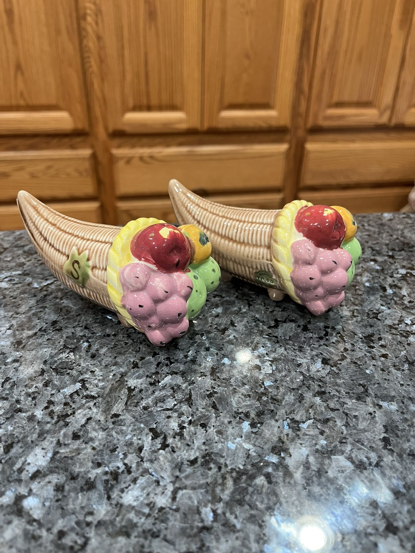 Vintage ceramic Handpainted Fruit pair of salt and pepper shakers. Size approximately 5 inches long, 2 1/2 inches tall and 2 1/2 inches wide.