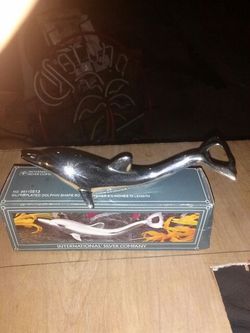 Silver dolphin bottle operner