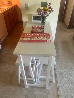 White kitchen table and stools with shelves