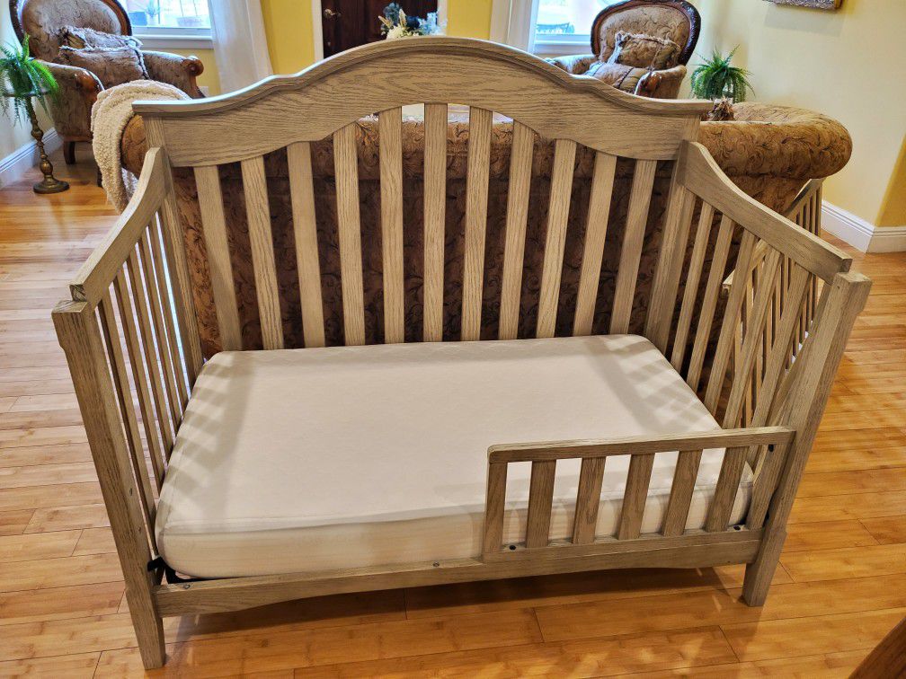 Beautiful Delta Farmhouse Crib with Toddler rail and changing table