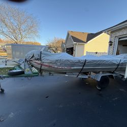 1976 14’ Aluminum Boat With 15 HP Evinrude Outbound Motor. 