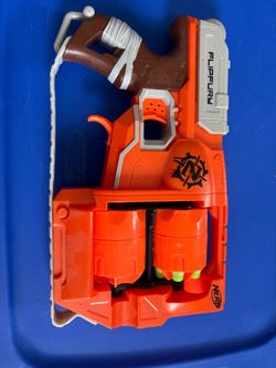 Nerf Zombie Strike Flip Fury Blaster with two rotating 6 dart drums. Missing 4 darts. Out of package almost new condition.