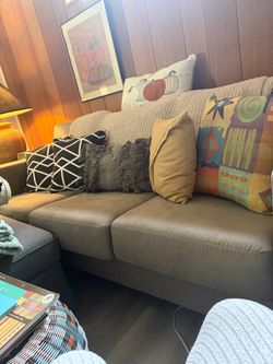 Amazing Confy couch no pets no stair great material has a flaw in rear of couch from when delivered but still like new 80 inches long asking 300 firm 