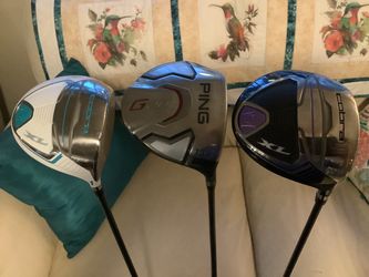 THREE VERY NICE GOLF DRIVERS. TWO NEW COBRA XL ND A NICE G20 PING.