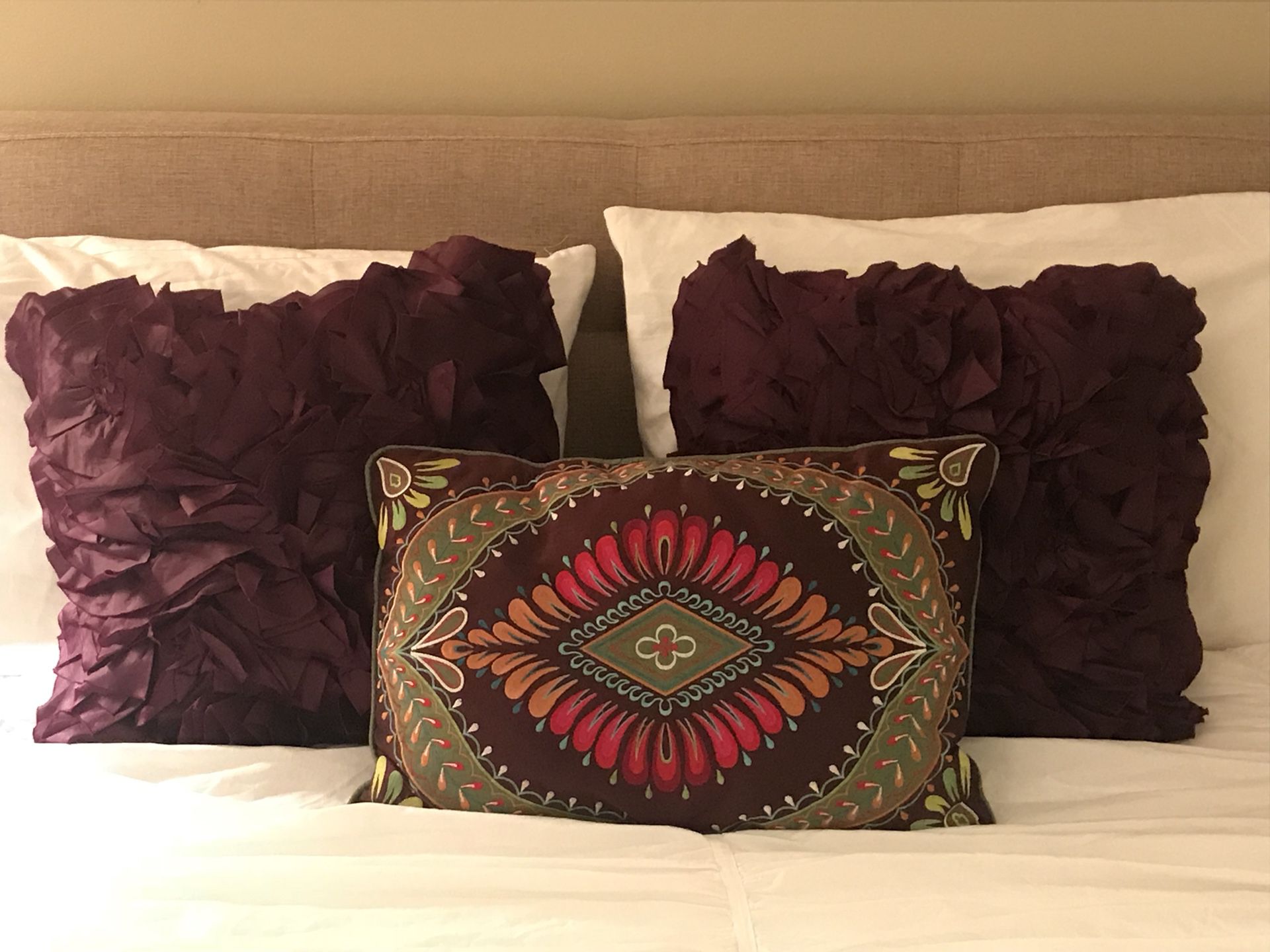 3 purple pier one decorating pillows