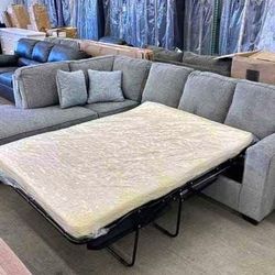Pull Out Bed Sectional Financing Available By ASHLEY 