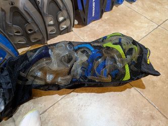Lot of 4  pair of fins and a bag of 12 snorkel masks  diving