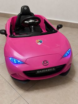 Pink Kids Electric Ride-On Mazda MX-5 in good working condition.