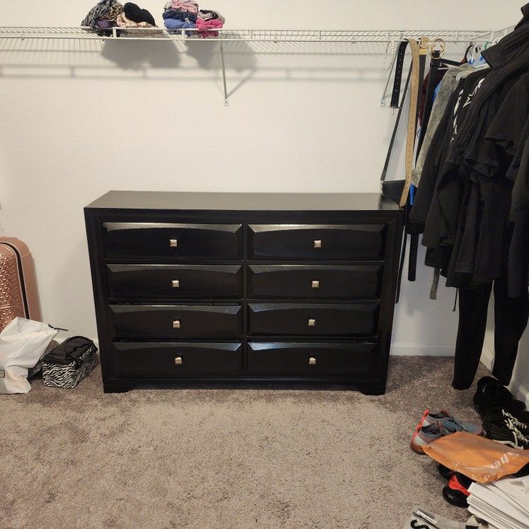 Brown 8-drawer dresser.