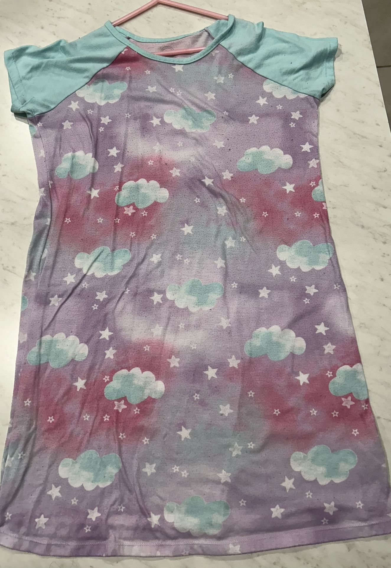 Purple nightgown with cloud and star pattern, short sleeves.