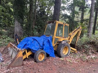 Ford Backhoe Tractor F 550 and 3-axle trailer. Reasonable Offers.