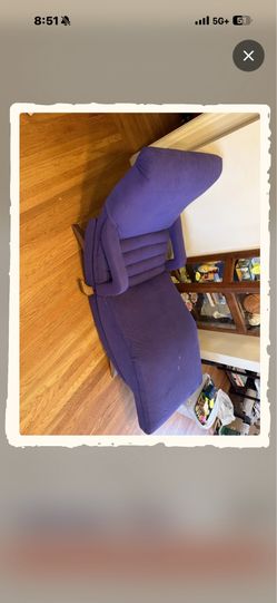 MCM purple lounge chair with wooden feet