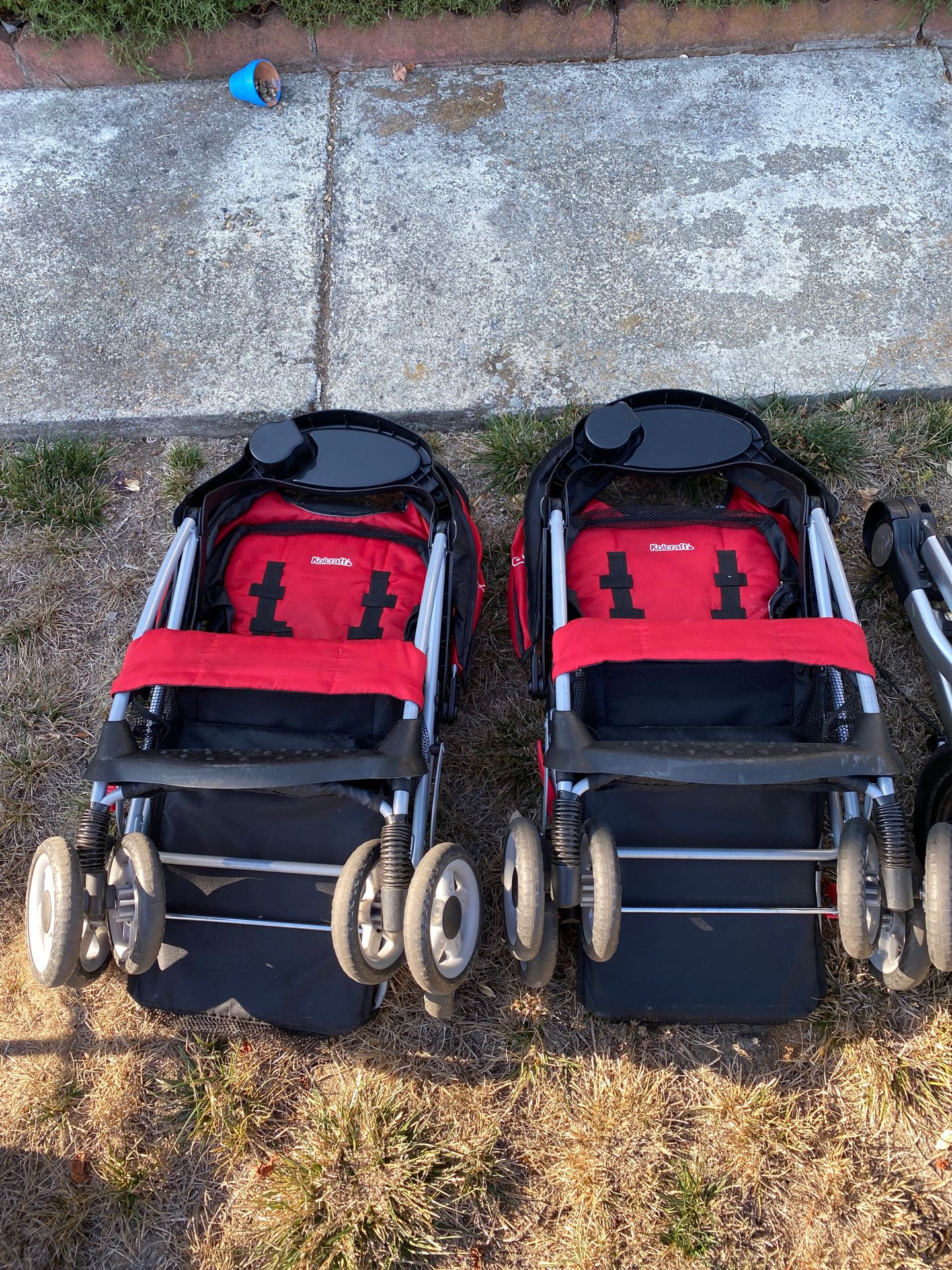 (2) Kolcraft Red one-hand folding strollers