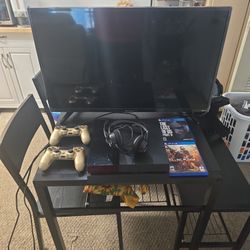 PS4 Console With 32 Inch T.V And 2 Ps4 Wireless Controllers  And  Wired Headset  And comes With 2 Ps4 Games