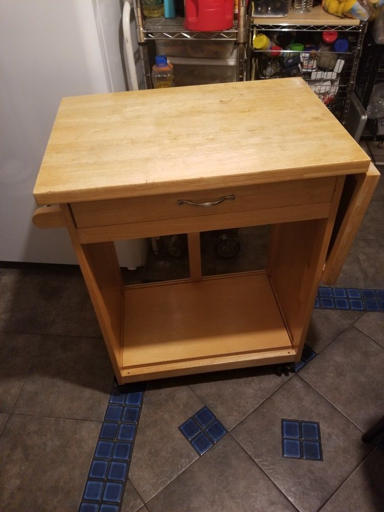 Wood table kitchen island with wheels