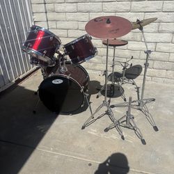 Full drum set with sticks and pedals