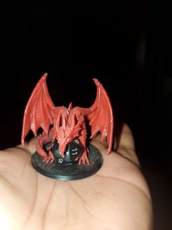 Red Dragon Guarding A 20 Sided Die
