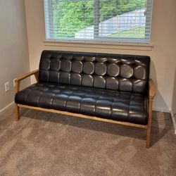 Like New Faux Leather Sofa