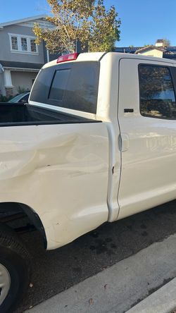 White Pickup Truck with Body Damageim