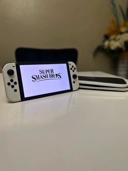 Nintendo Switch OLED + Super Smash Bros ultimate