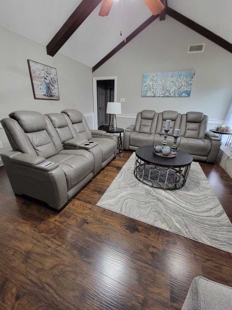 Color Is Gray & Is Made From Leather. Electric Couches, Wireless Charging, 3 Living Room Tables, And Cuholders