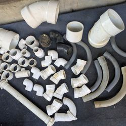 BOX FULL OF PVC PIPE FITTINGS