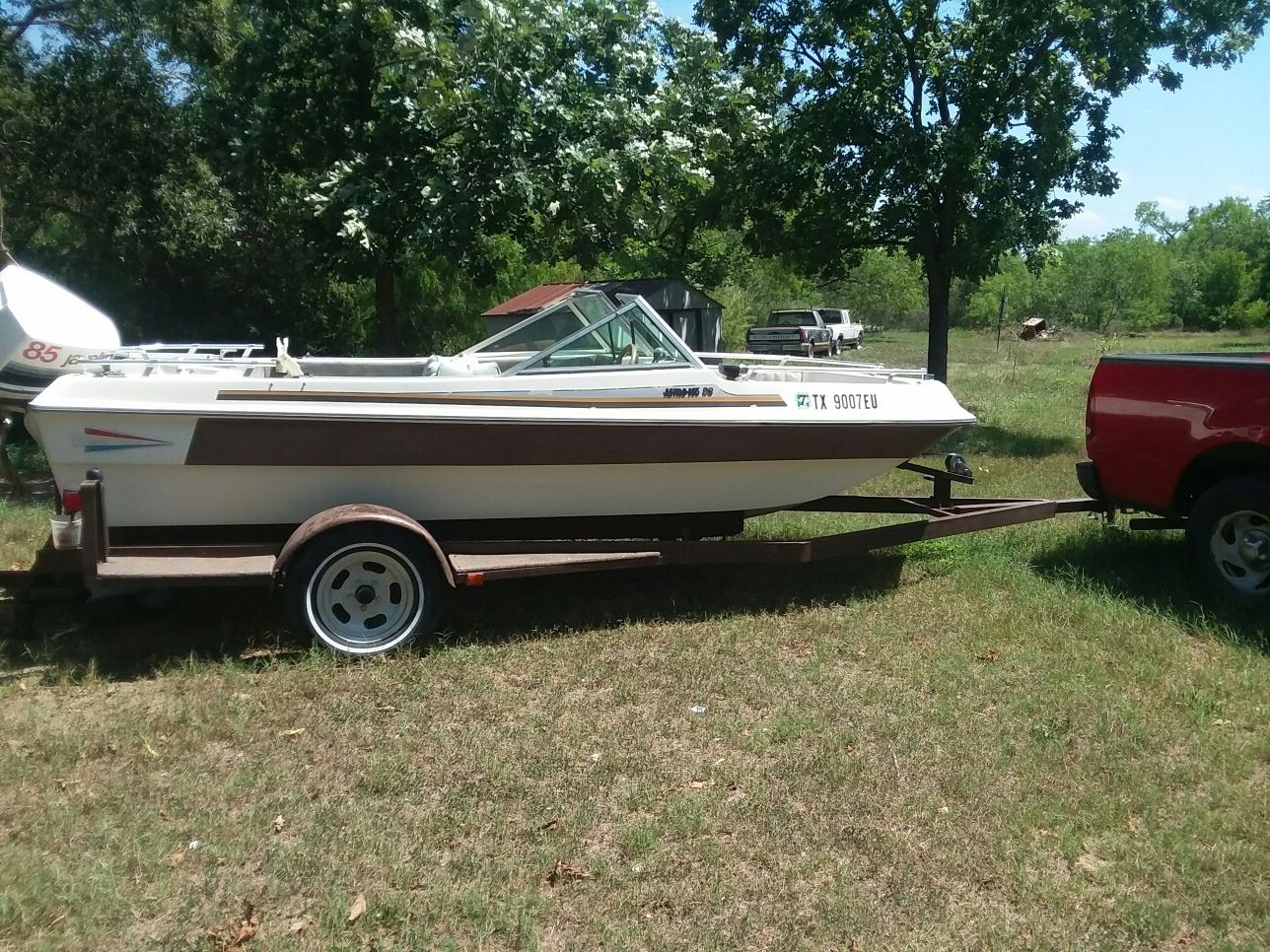 Boat,javelin outboard motor, trailer