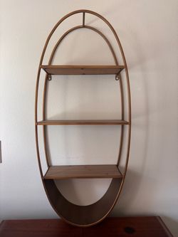 Oval hanging shelf