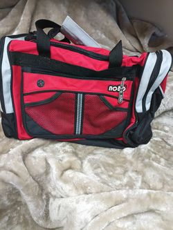 Vintage 1990's No Boundaries brand new grey, black, and red nylon duffle bag with handles and a shoulder strap.
