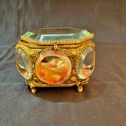 Antique French ormolu and beveled glass jewelry box with velvet lining.  Ormolu, which is French for "gilded bronze," refers to the technique of apply