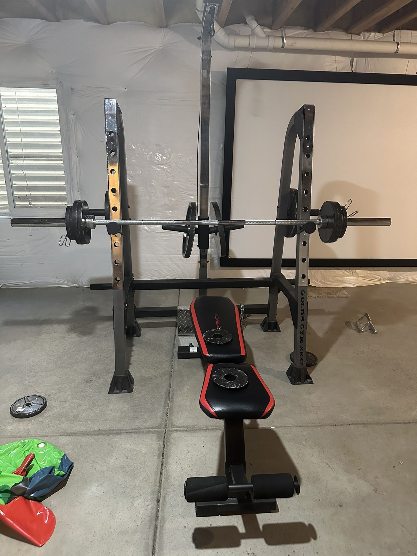 Weight Bench with Barbell and Weights