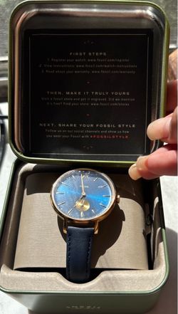 Fossil Kalya watch features a blue sunray dial contrasted by a gold-tone case and navy blue leather strap a