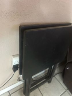 2x black foldable tables