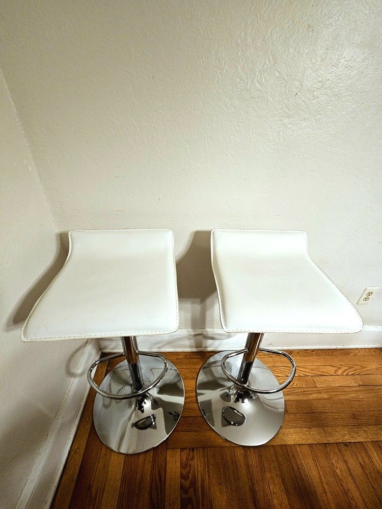 Pair Of White Faux Leather Adjustable Height Bar Stools With Chrome Base And Foot Rest