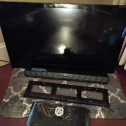 LG TV W/ WALL MOUNT & SOUND BAR 