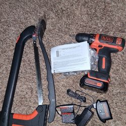 Black And Decler Used Once And A BBQ Scrubber And A Saw Never Used 