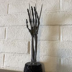 Wolverine Skeleton Hand Statue