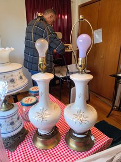 Pair of hand painted ceramic lamps
Bone color with gold accents
26.5" h x 7"w