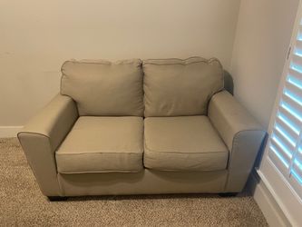 Free loveseat on Rockhill Rd. in Mckinney TX.  Good condition. Already outside and ready to go.