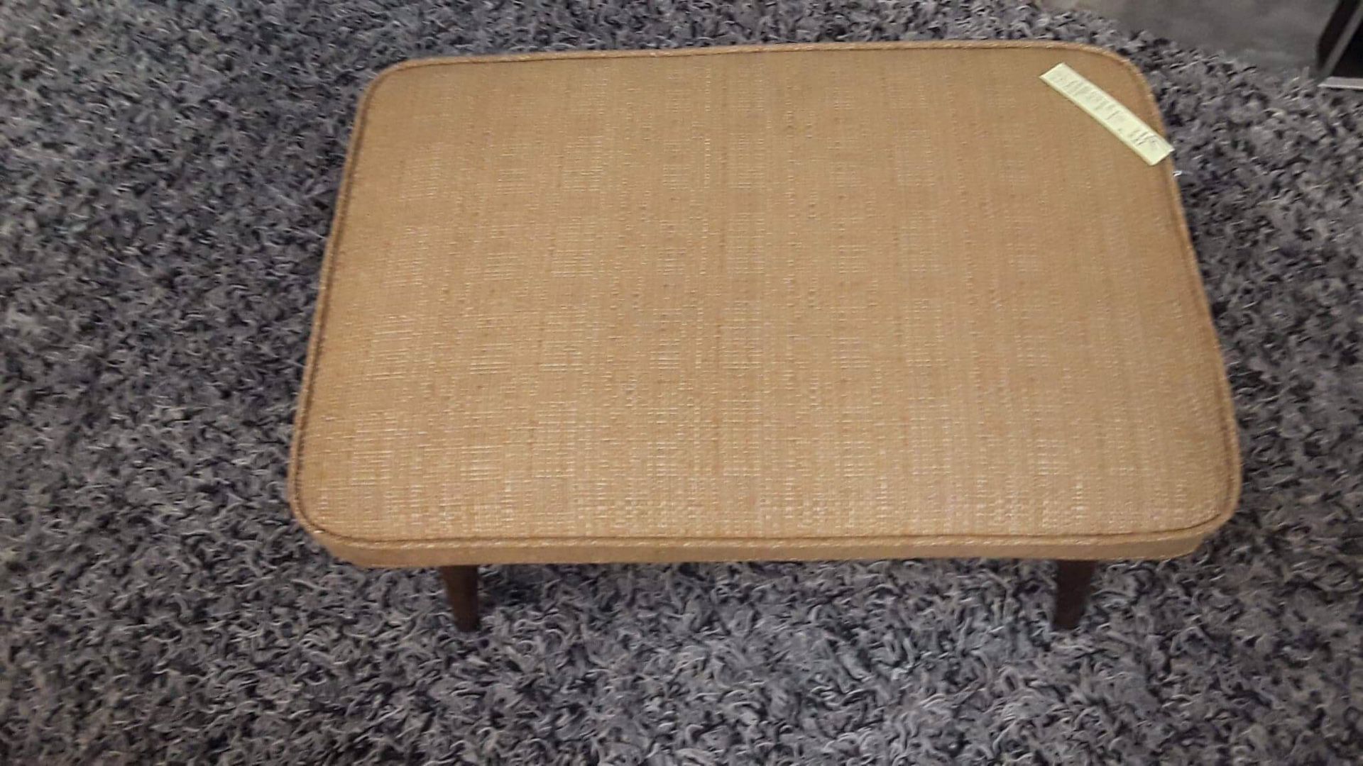 Vintage Mid Century reupholstered Foot Stool with wooden tapered legs. Price $95. Located at Long Beach Antique Mall 2, signal Hill, Ca