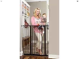 Baby gate extra tall 37 inches wide 41 inches high. It is new