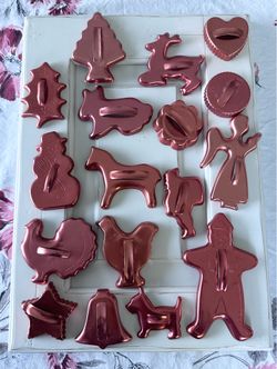 Set of 17 Vintage Mirro Copper color Aluminum all season cookie cutters mostly Christmas  All in very good condition