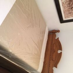 Solid oak queen bed frame brand new condition with brand new condition solid memory foam mattress with box springs. Must go this week