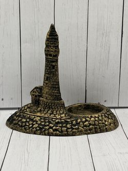 Cast iron lighthouse candle holder