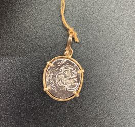 Atocha silver coin pendant in gold bezel