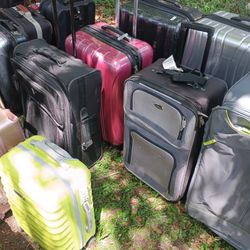 LOTS OF NICE PULL ALONG LUGGAGE 