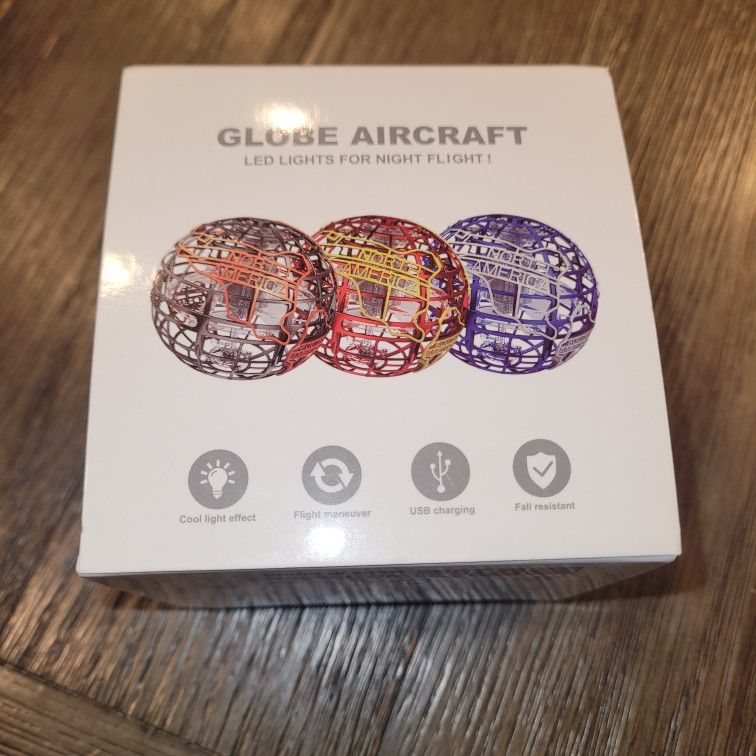 Brand new in box. LED flying orb toy