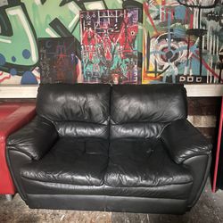 Black leather love seat couch 