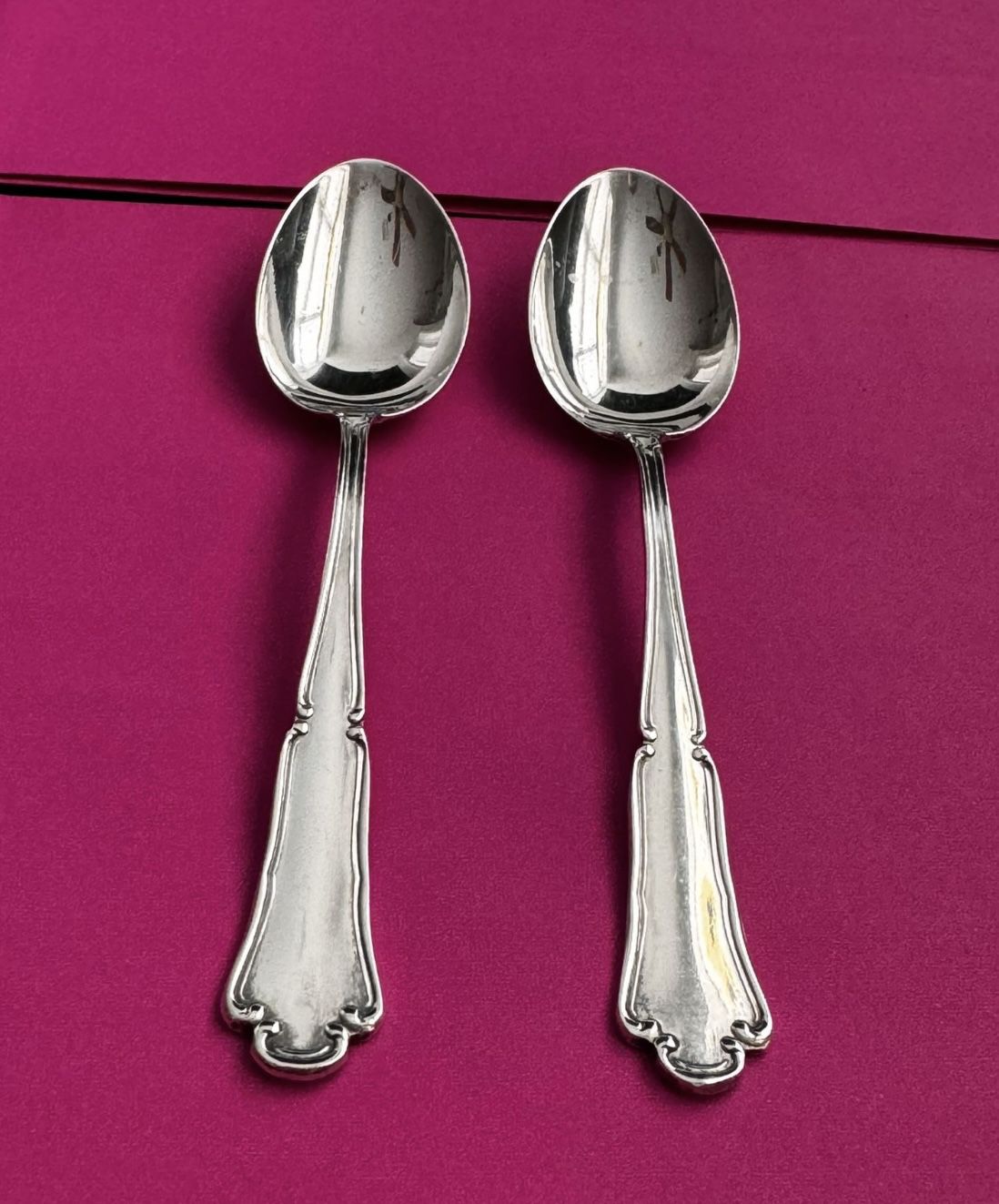 Pair of sterling silver tea spoons marked 800  Approx 4 inches each  In great condition
