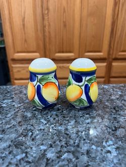 Vintage Ceramic Fruit Design” Pair of Salt and Peppers Shakers.  Size approximately 3 inches.  Preowned .  Has been on display in a cabinet with a ver